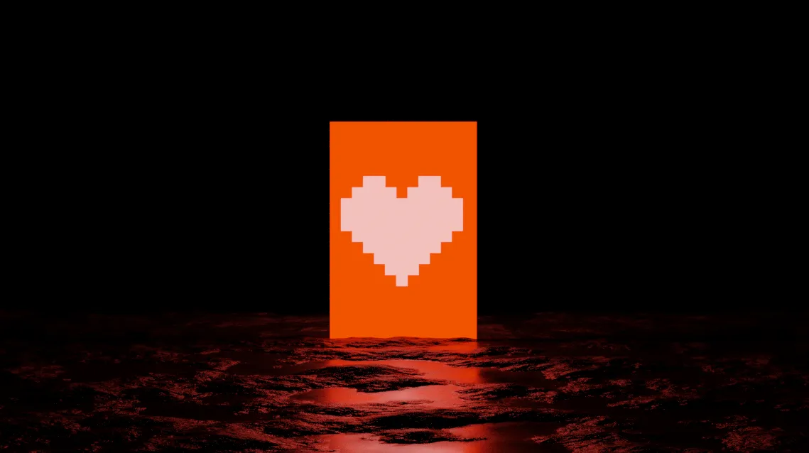 a monitor containing a pixelated heart image over a rocky landscape, projecting a bright red light.